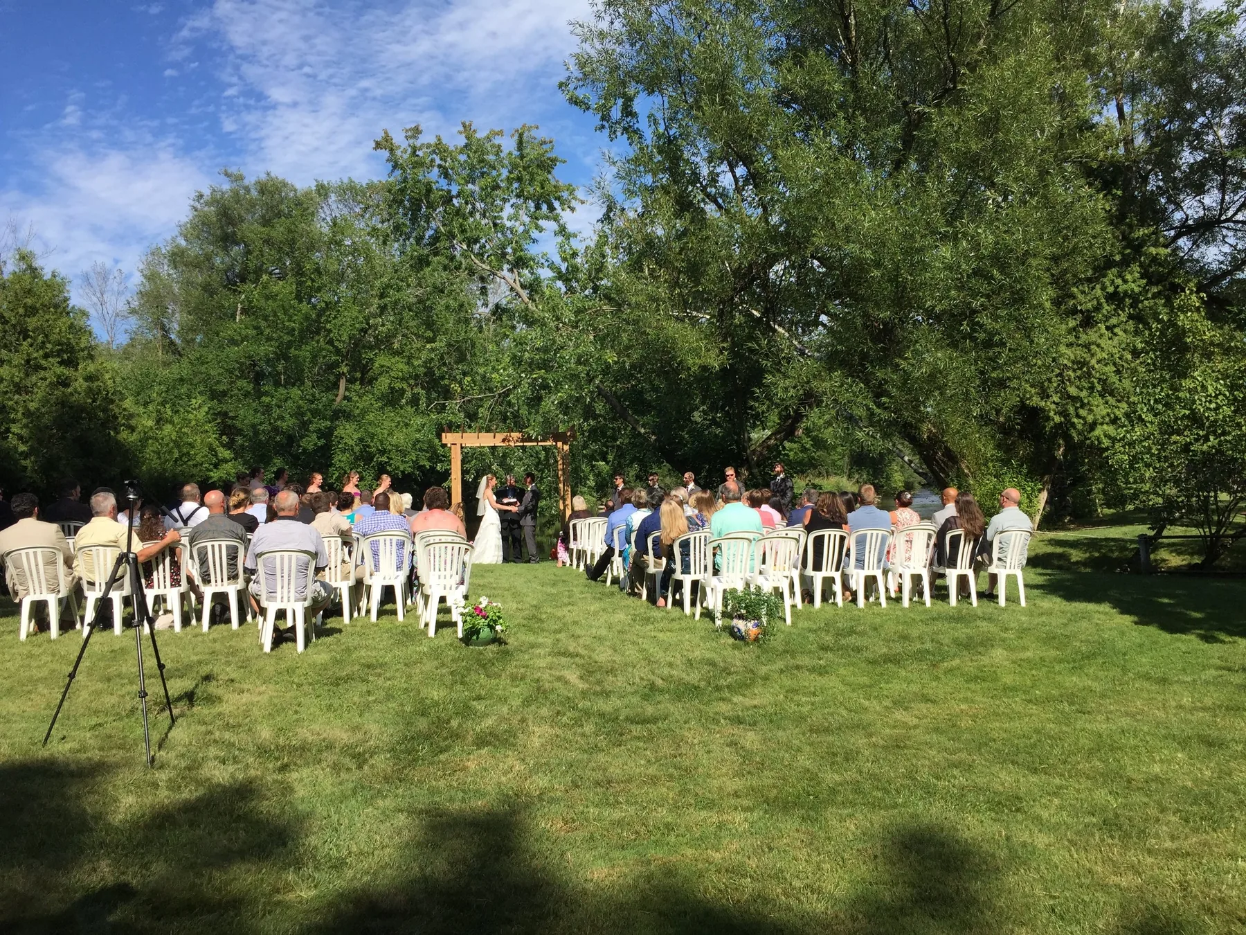 Outdoor wedding ceremony on the River Park lawn