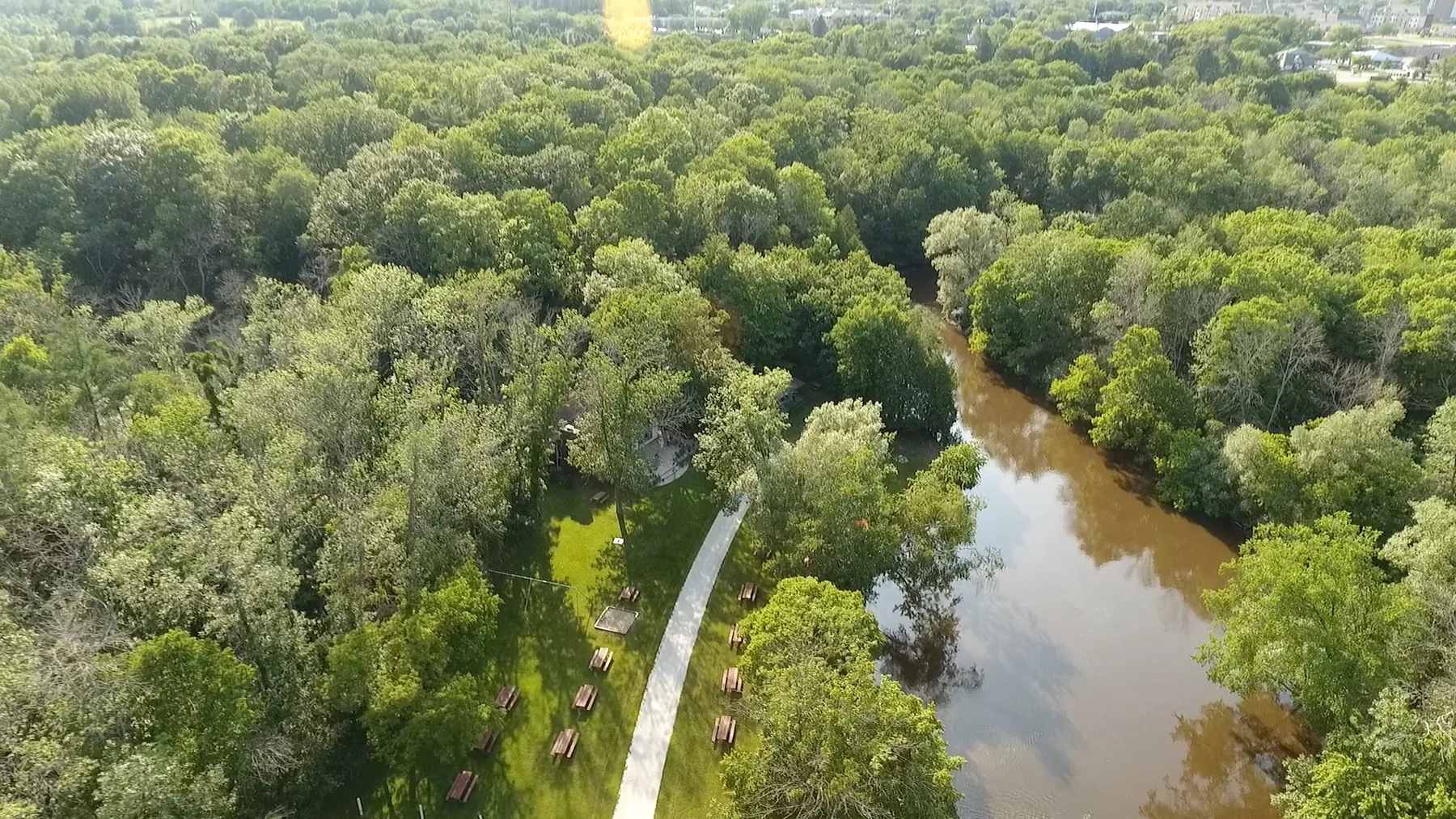 Aerial view of the wooded River Park estate beside the river